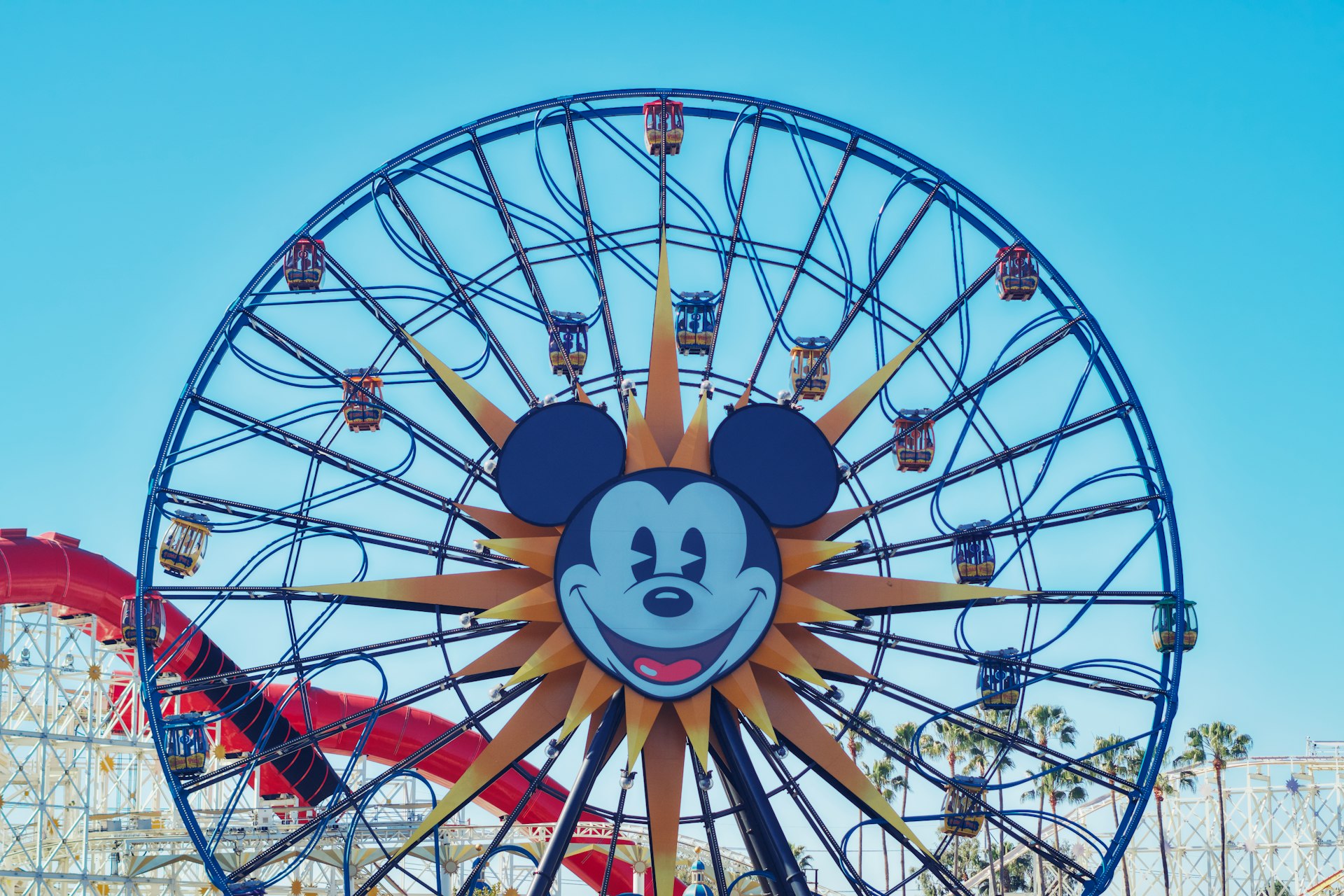 A ferris wheel with a mickey mouse face on it